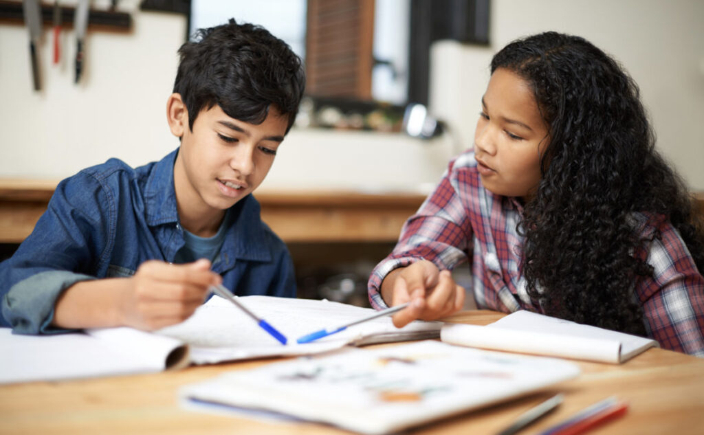 Two children doing school work together